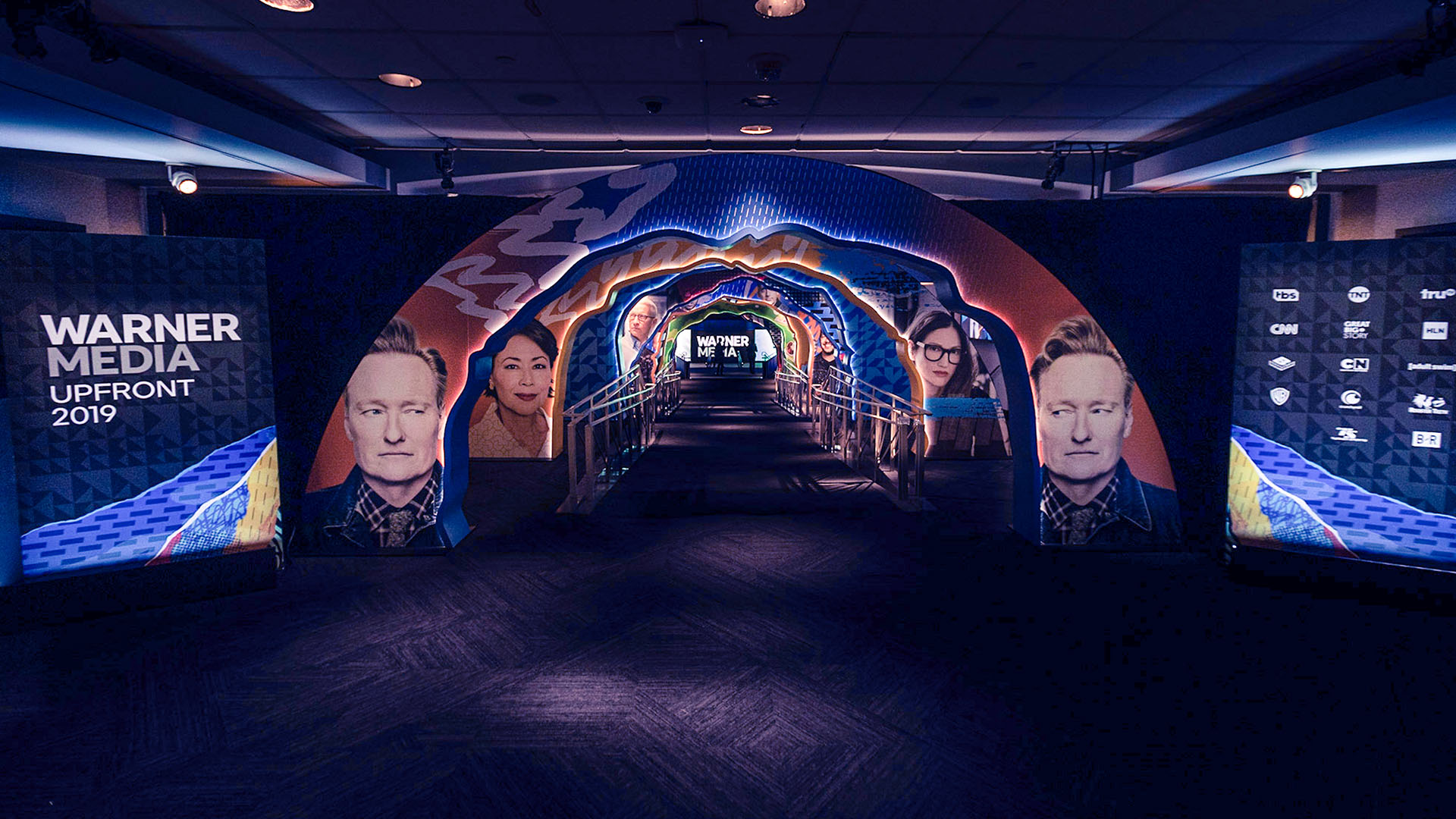 video tunnel displaying conan obrien, anderson cooper, and other media personalities
